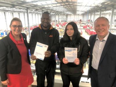 Dr Tracey Worth with apprentices Olusegun and Amber and Whistl boss Alistair Cochrane